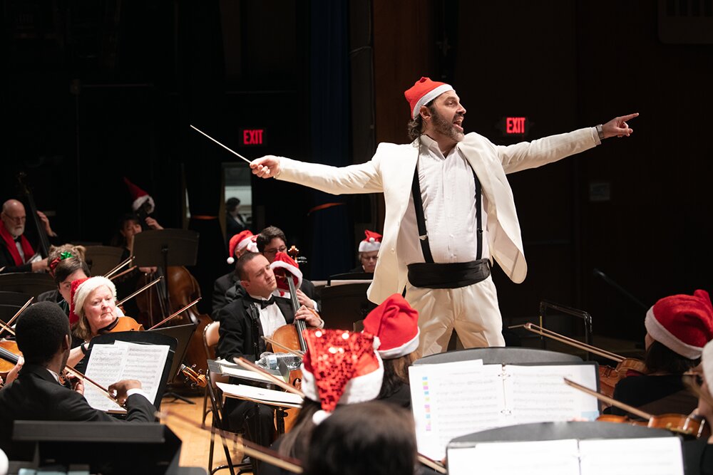 Russell Ger, in his most festive conducting attire, leads the Greater Newburgh Symphony at its holiday concert.